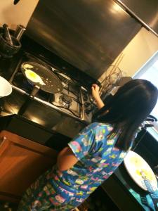 Catie making pancakes
